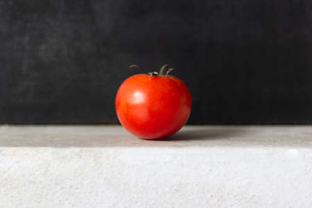 Ripe tomato on natural light background.の写真素材