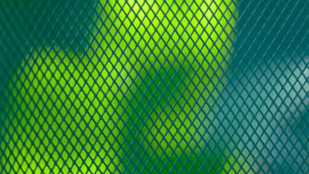 Rhombus pattern steel grating on natural light background.の写真素材