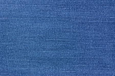 Blue jeans texture on natural light background.の写真素材