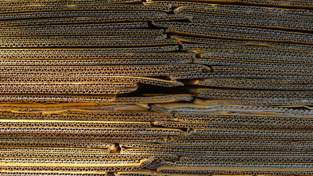 Stack of used cardboard waste for recycling.