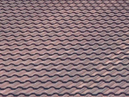 Contemporary red roof tiles pattern texture background.