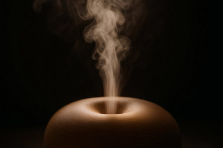 Macro shot of a mist diffuser emitting a fine, fragrant mist into the air.の素材