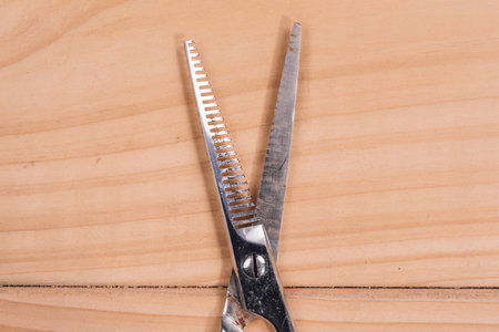 scissors for work of hairdresser on the wood tableの写真素材