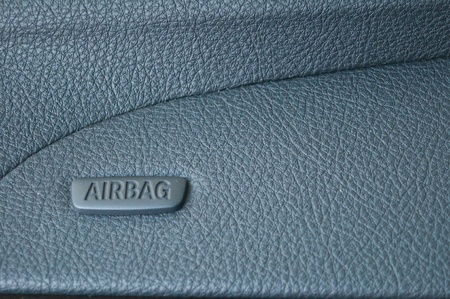 Airbag symbol on leather console in a carの写真素材