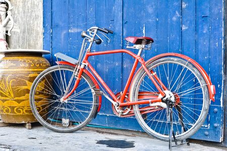 Antique red bicycleの写真素材