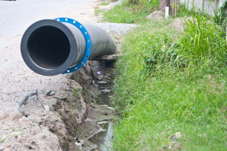Water rubber tube buried in the ditchの写真素材