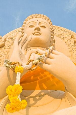 Buddha statue againt in the blue sky backgroundの写真素材