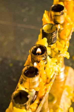 Burning candle on candlestick in thai styleの写真素材