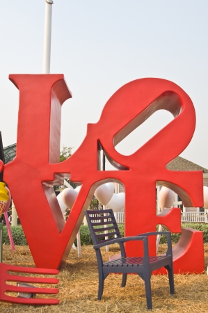 Love in red wording statueの写真素材