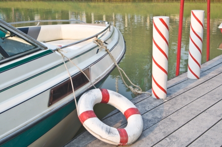 Speed boat  and life buoy at woods pierの写真素材
