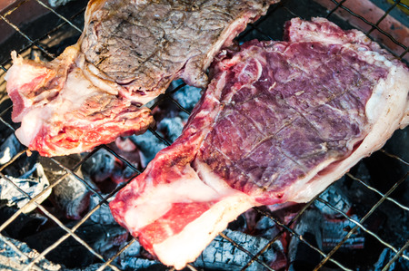 Raw meat on the gratingの写真素材