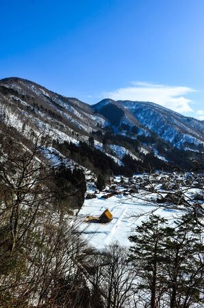 Panorama view of World Heritage Shirakawa Go village against blue skyのeditorial素材
