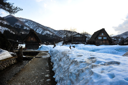 Silhouette of snow wall and Old wooden houseのeditorial素材