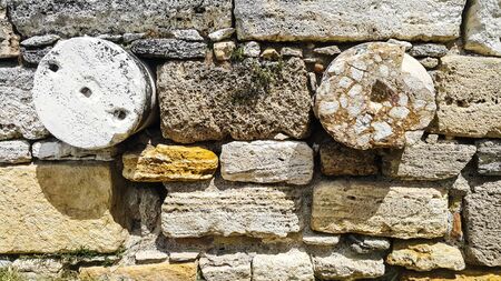 Round stone and old stone in the ancient wallの写真素材