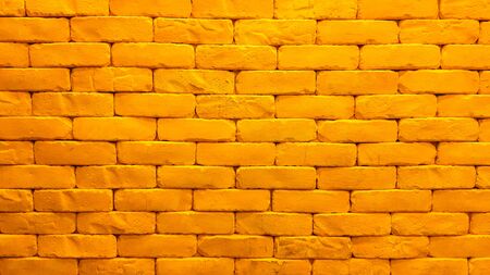 Interior design of yellow brick wall with lightingの写真素材