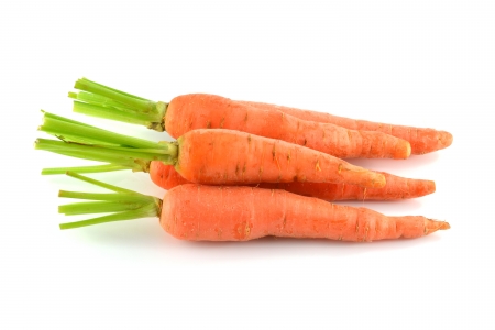 Carrot vegetable with leaves isolated on white background の写真素材