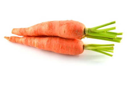 Carrot vegetable with leaves isolated on white background の写真素材