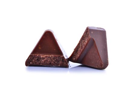 Chocolate pieces isolated on white backgroundの写真素材