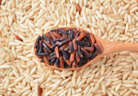 Coarse rice and red rice backgroundの写真素材