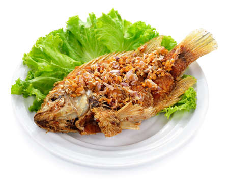 Fish dish - fried fish fillet with vegetablesの写真素材