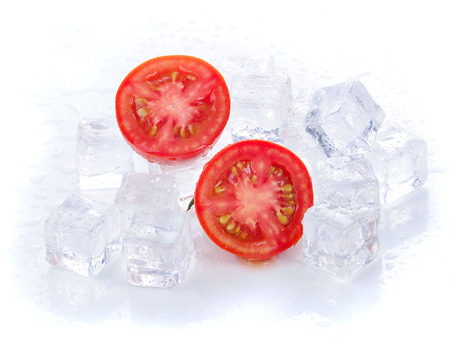 Tomatoes with ice isolated on white backgroundの写真素材