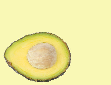 Avocado fruit on yellow background.の写真素材