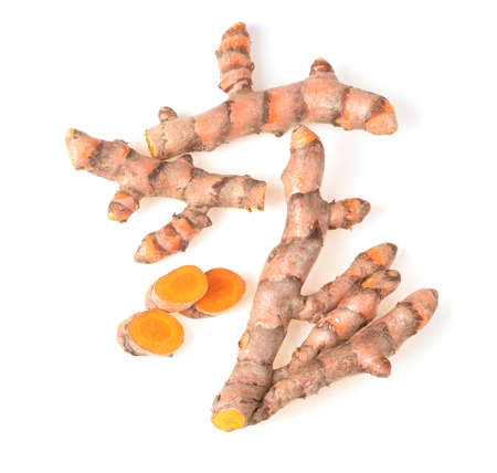 fresh turmeric isolated on white backgroundの写真素材