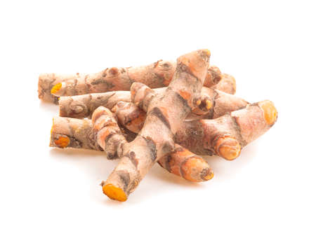 fresh turmeric isolated on white backgroundの写真素材