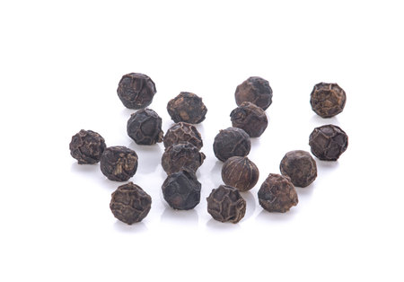 black peppercorns isolated on white backgroundの写真素材