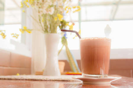 Hot cocoa mixed with milk in the morningの写真素材