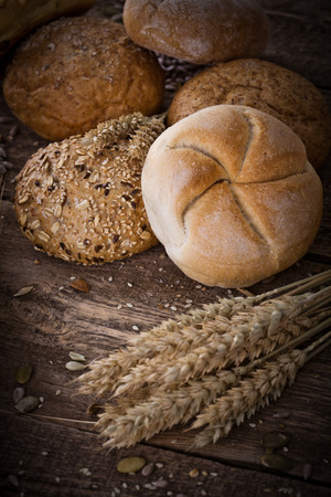 fresh bread and wheat on the wooden - rusticの写真素材
