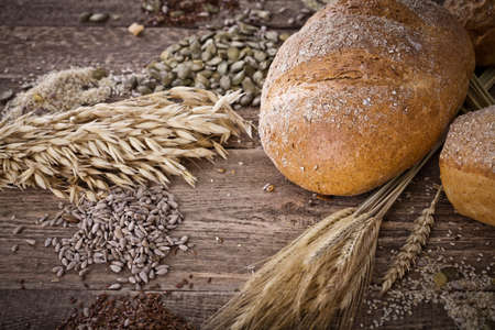 fresh bread and wheat on the wooden - rustic 