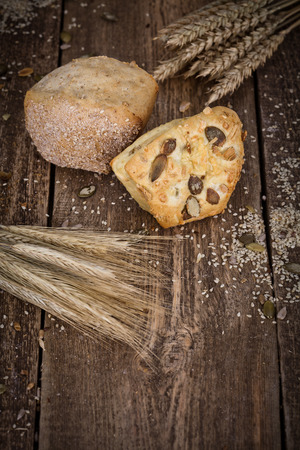 fresh bread and wheat on the wooden - rustic の写真素材