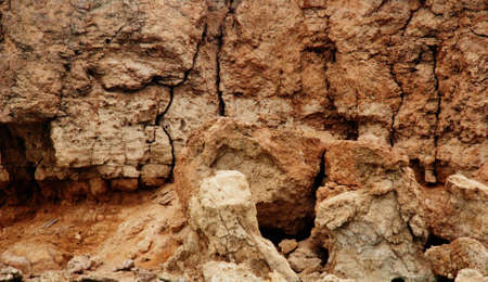Cracked wall from a pieces of a red clayの写真素材