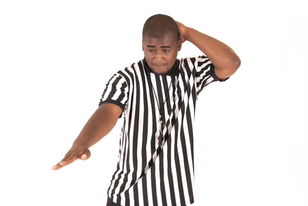 Black referee indicating an offensive foul callの写真素材