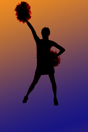 Cheerleader silhouette standing with orange blue backgroundの写真素材