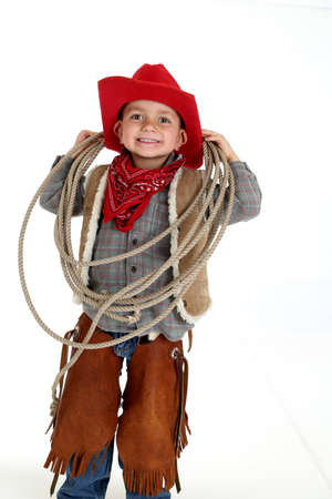 funny young cowboy with floppy ears smilingの写真素材
