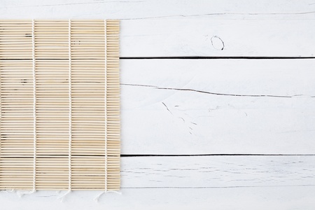 Makisu mat on a white aged table with copy spaceの写真素材