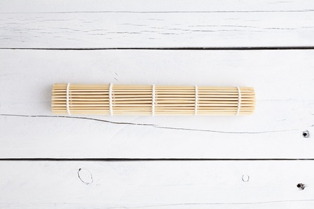 Makisu for make sushi rolled on a white aged tableの写真素材