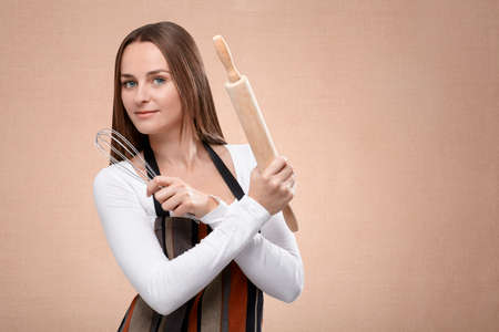 Young happy female cook with confident look
