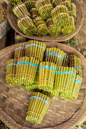 Tobacco rolled in leaves, sold on market in Myanmarの写真素材