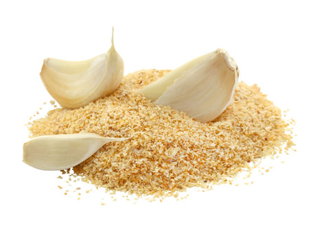 Garlic cloves and grated garlic isolated on a white background.の写真素材