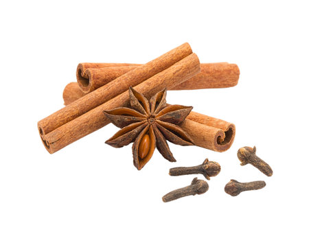 cinnamon sticks, anise and cloves isolated on white background.の写真素材