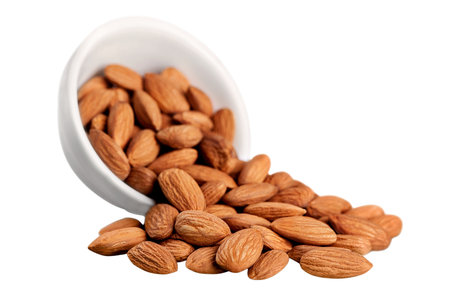 Almond nuts in bowl isolated on white background, clipping path includedの写真素材