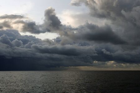 Mediterranean sea in the evening. gray clouds