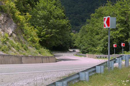 Curved asphalt road in high mountains. summer dayの写真素材