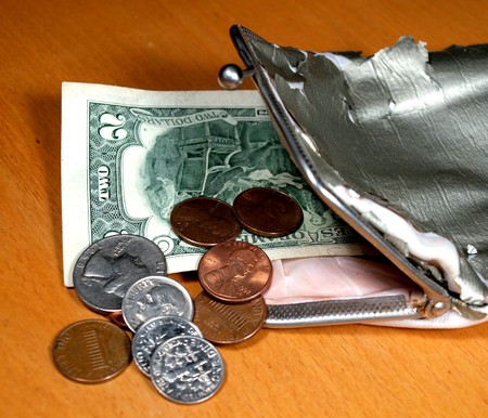       Old purse with several coins and a denomination