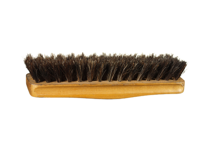 Old clothes (or shoe) brush with wooden handle isolated on the white background