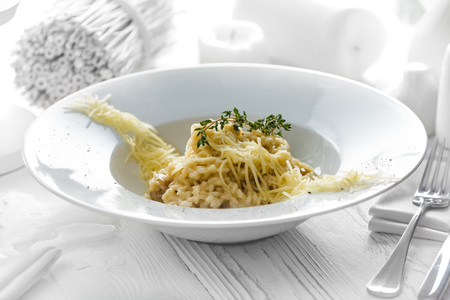 Tasty spaghetti with cheese on a white plateの写真素材