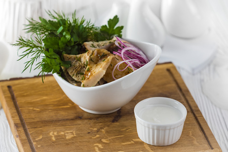 Pickled mushrooms with sauce in a bowlの写真素材